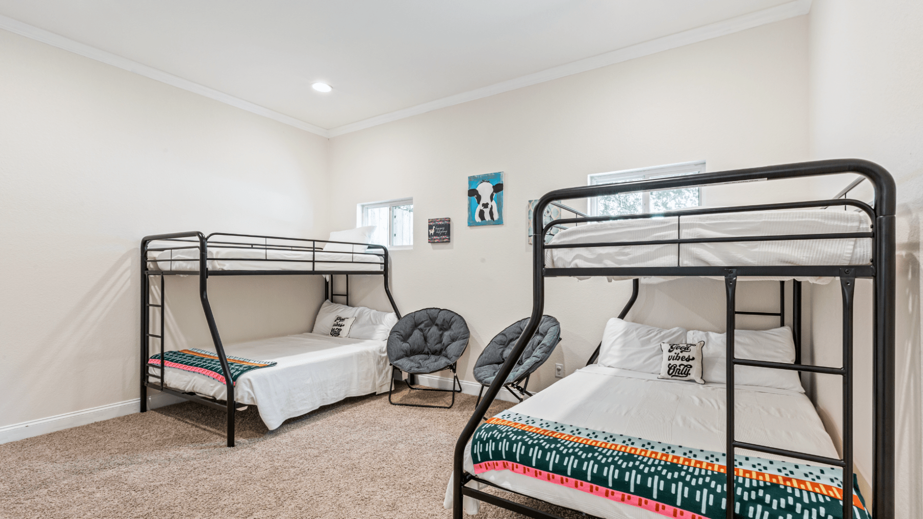 a bedroom with a bed and desk in a room